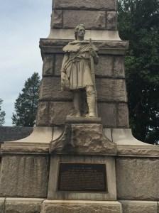 A detail of the frontiersman depicted on the obelisk.
